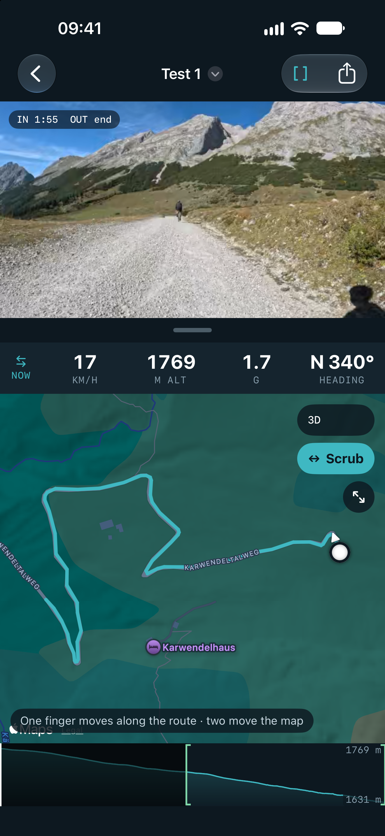 GPXCam on an iPhone: a mountain road on video above a map with the route in teal, live speed, altitude and heading between them.